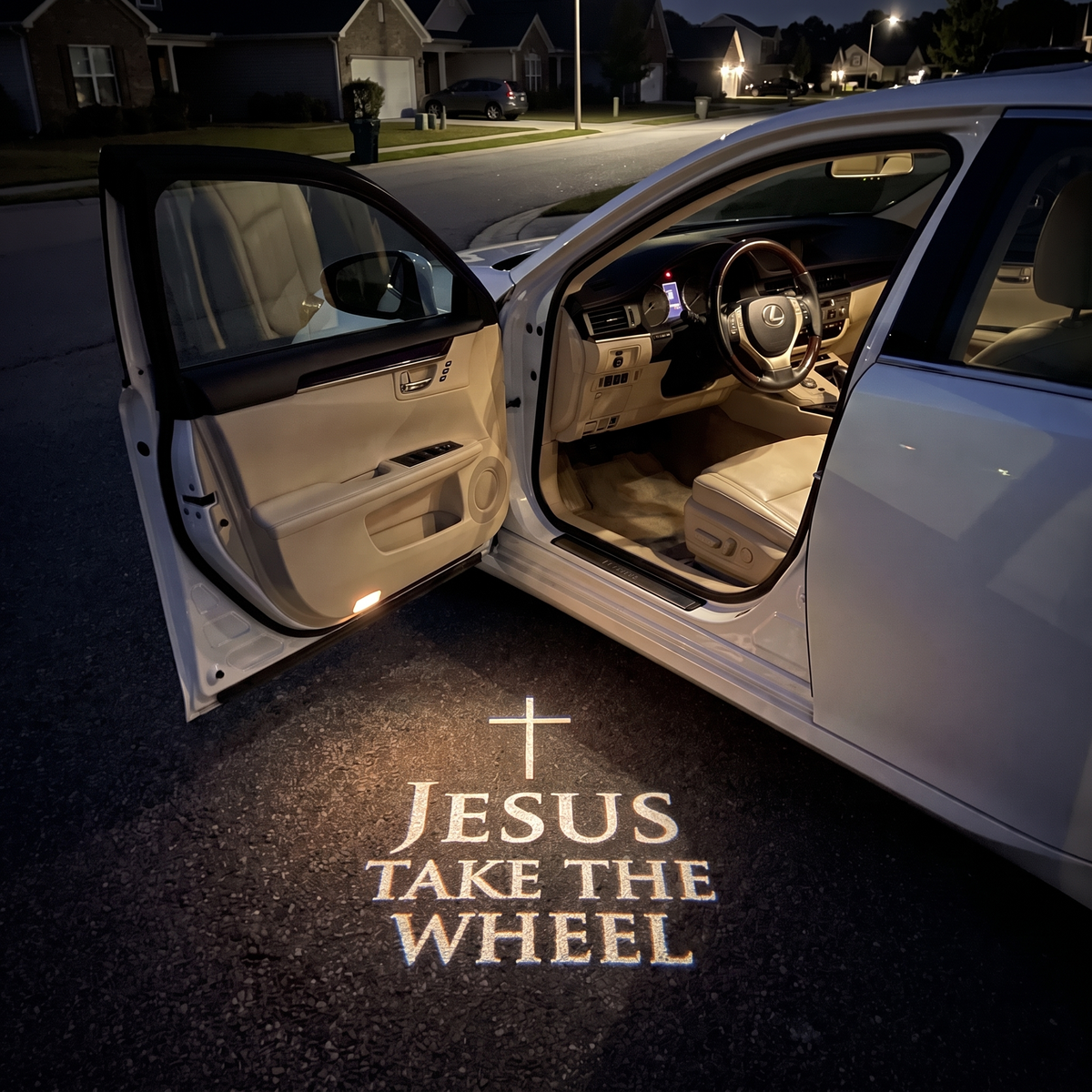 HaloDoor projecting Jesus Take the Wheel on the ground beside an open car door at night